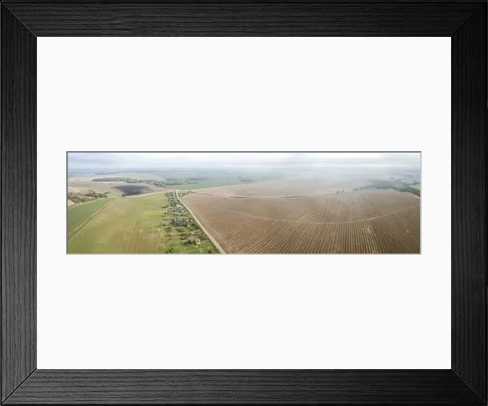 Framed Print : panoramic aerial view of countryside landscape with village among agricultural fields in the autumn morning mist Framed Print : panoramic aerial view of countryside landscape with village among agricultural fields in the autumn morning mist