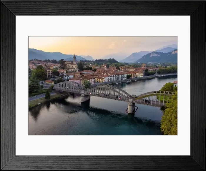Framed Print : Drone panoramic view Over Bridge And River Towards a characteristic Italian village, Brivio, Lombardy, Italy Framed Print : Drone panoramic view Over Bridge And River Towards a characteristic Italian village, Brivio, Lombardy, Italy
