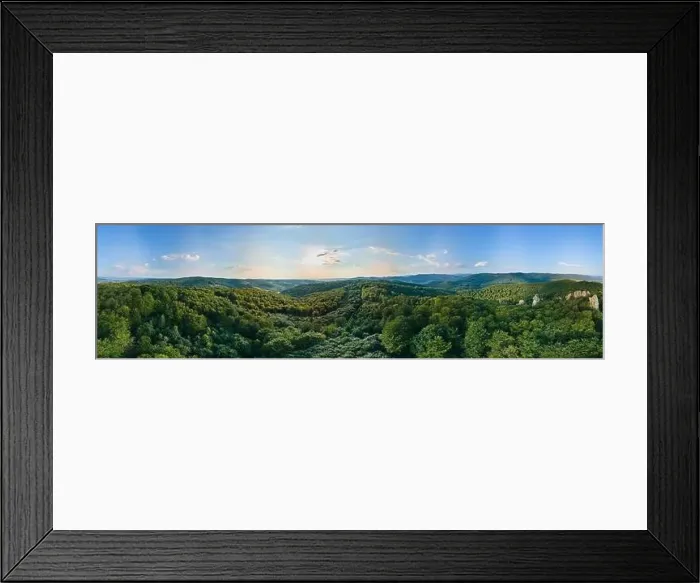 Framed Print : Aerial view of mountain hills covered with dense green lush woods on bright summer day Framed Print : Aerial view of mountain hills covered with dense green lush woods on bright summer day