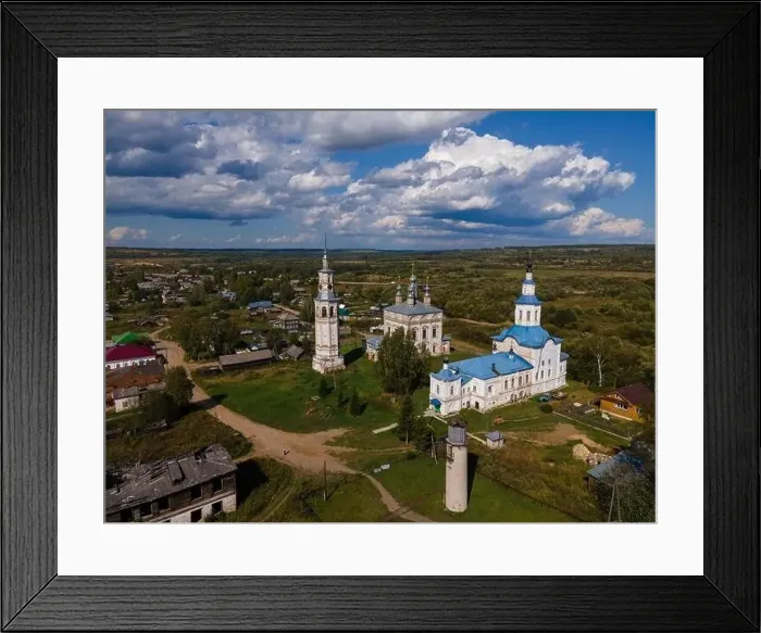 Framed Print : Old churches and chapel on lawn against buildings in suburb Framed Print : Old churches and chapel on lawn against buildings in suburb