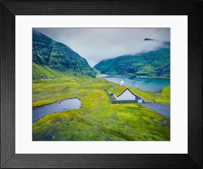 Framed Print : View from flying drone. Gloomy summer view of Saksun village with Saksunar Kirkja church Framed Print : View from flying drone. Gloomy summer view of Saksun village with Saksunar Kirkja church