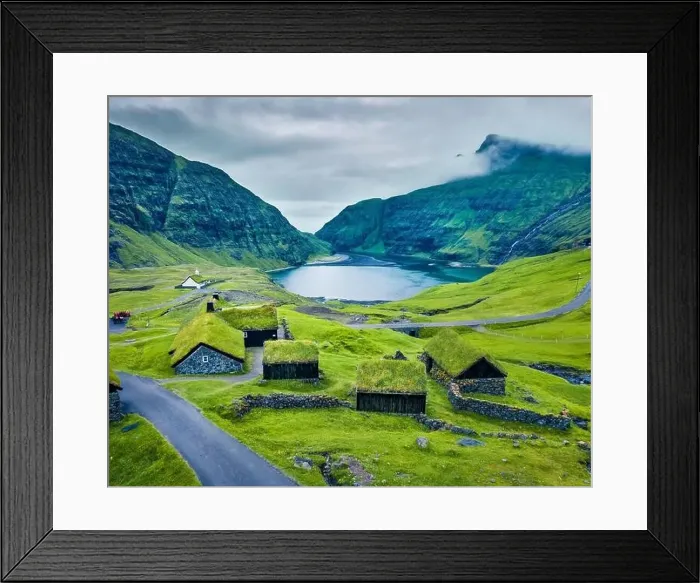 Framed Print : View from flying drone. Green summer scene of Saksun village with typical turf-top houses and Saksunar Kirkja Framed Print : View from flying drone. Green summer scene of Saksun village with typical turf-top houses and Saksunar Kirkja