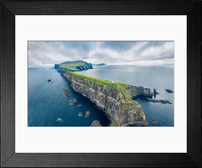 Framed Print : View from flying drone. Gloomy summer scene of Mykines island with old lighthouse Framed Print : View from flying drone. Gloomy summer scene of Mykines island with old lighthouse