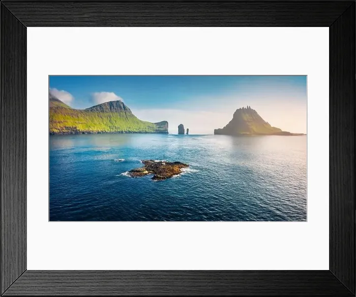 Framed Print : View from flying drone. Misty summer scene of Faroe Islands and Tindholmur cliffs on background Framed Print : View from flying drone. Misty summer scene of Faroe Islands and Tindholmur cliffs on background