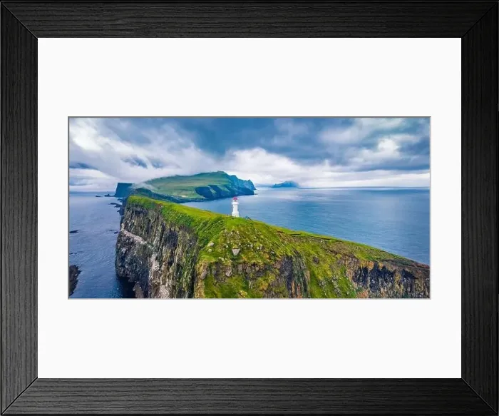 Framed Print : View from flying drone. Gloomy summer scene of Mykines island with old lighthouse Framed Print : View from flying drone. Gloomy summer scene of Mykines island with old lighthouse