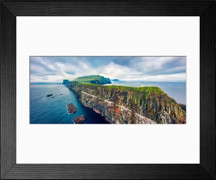 Framed Print : Panoramic view from flying drone of Mykines island with old lighthouse Framed Print : Panoramic view from flying drone of Mykines island with old lighthouse