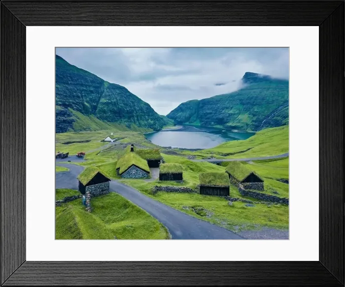 Framed Print : Dramatic summer view from flying drone of Saksun village with traditional turf-top house Framed Print : Dramatic summer view from flying drone of Saksun village with traditional turf-top house