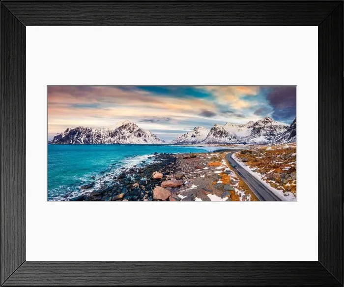 Framed Print : Dramatic spring sunset on Vestvagoy island with asphalt road and drining car Framed Print : Dramatic spring sunset on Vestvagoy island with asphalt road and drining car