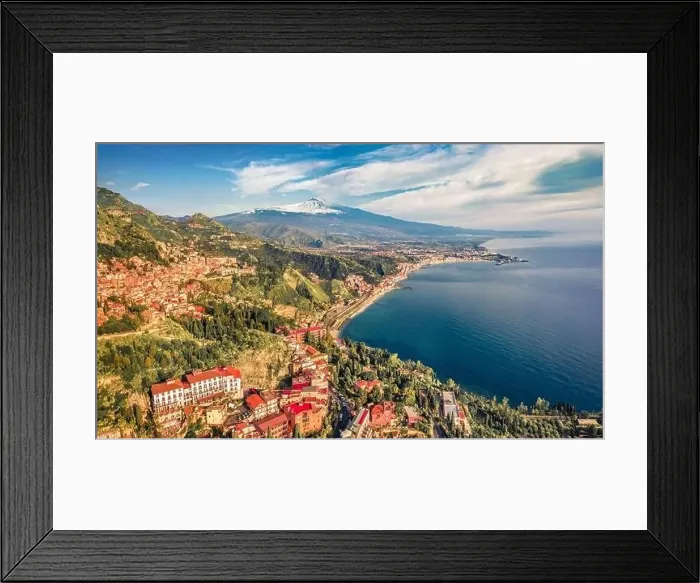Framed Print : View from flying drone of Taormina town and Etna volcano on background Framed Print : View from flying drone of Taormina town and Etna volcano on background