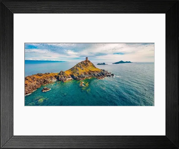 Framed Print : View from flying drone of popular tourist destination Torra di a Parata - 16th-century Genoese tower reached by a rocky Framed Print : View from flying drone of popular tourist destination Torra di a Parata - 16th-century Genoese tower reached by a rocky