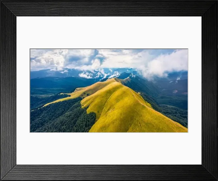 Framed Print : View from flying drone of Svydovets mountain range with old country road in August Framed Print : View from flying drone of Svydovets mountain range with old country road in August