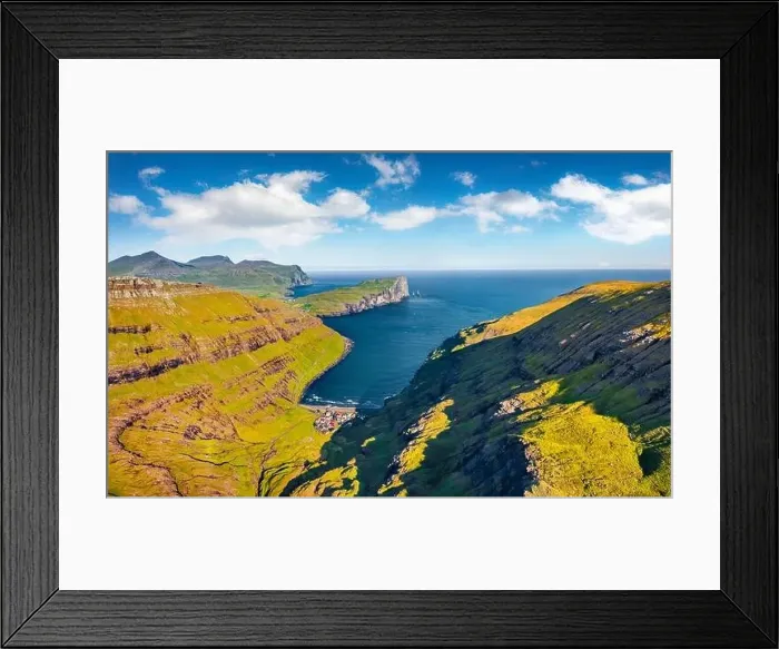 Framed Print : View from flying drone of Tjornuvik village with Eidiskollur cliffs on background Framed Print : View from flying drone of Tjornuvik village with Eidiskollur cliffs on background