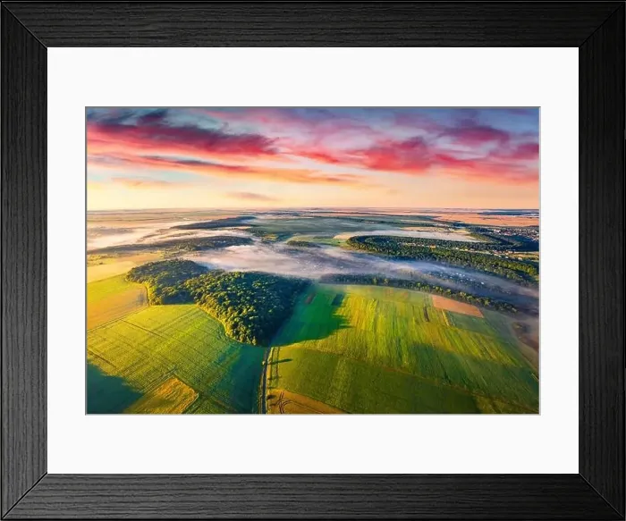 Framed Print : View from flying drone of Ukrainian countryside with field of wheat and foggy valleys Framed Print : View from flying drone of Ukrainian countryside with field of wheat and foggy valleys