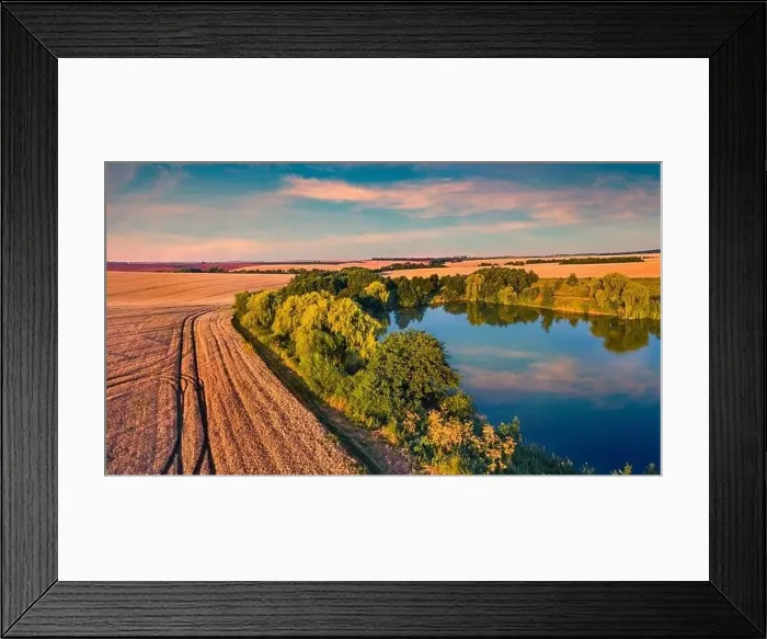 Framed Print : Sunny summer sunset on outskirts of Ternopil town with small pond Framed Print : Sunny summer sunset on outskirts of Ternopil town with small pond