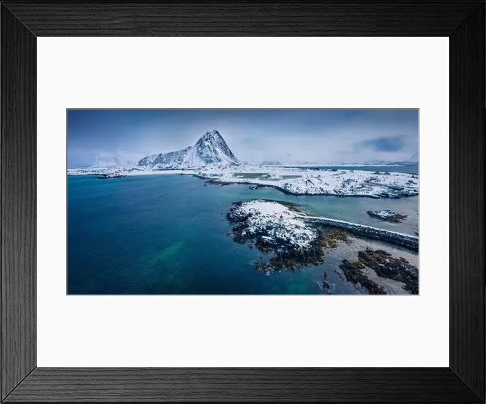 Framed Print : Dramatic winter view from flying drone of small fishing village - Hovsund