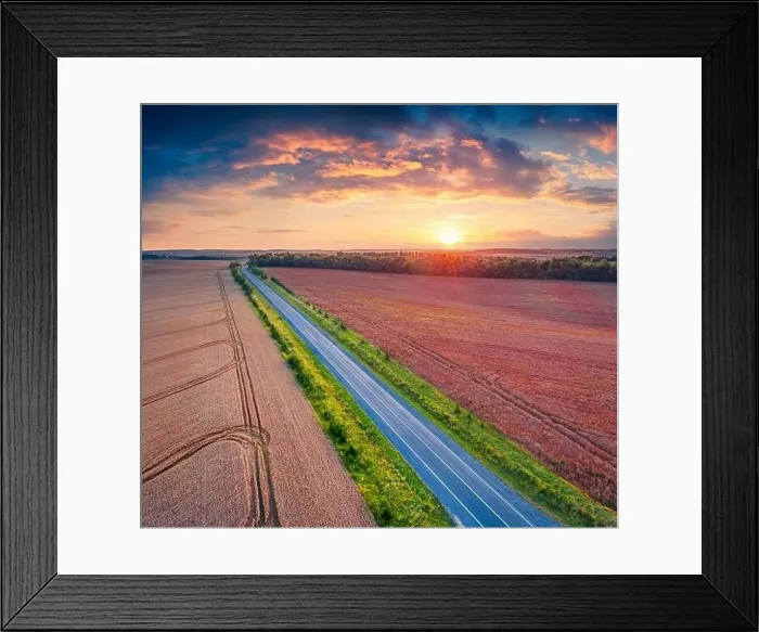Framed Print : Fantastic sunrise on Ukrainian countrysidewith asphalt road among the field of wheat Framed Print : Fantastic sunrise on Ukrainian countrysidewith asphalt road among the field of wheat