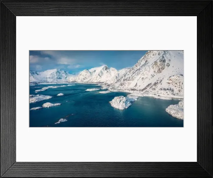Framed Print : Red wooden house on the cliff. Dramatic winter view from flying drone of Sandvika bay Framed Print : Red wooden house on the cliff. Dramatic winter view from flying drone of Sandvika bay