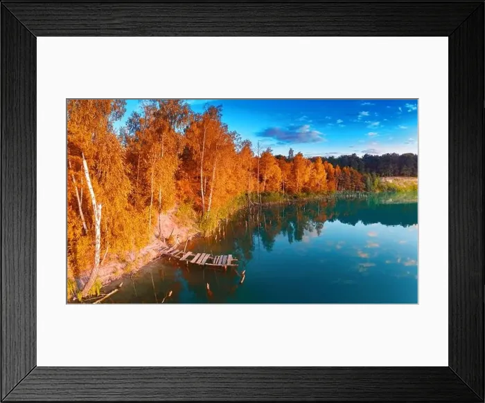 Framed Print : A small island in the middle of the lake, yellow autumn leaves on the trees. Drone view Framed Print : A small island in the middle of the lake, yellow autumn leaves on the trees. Drone view
