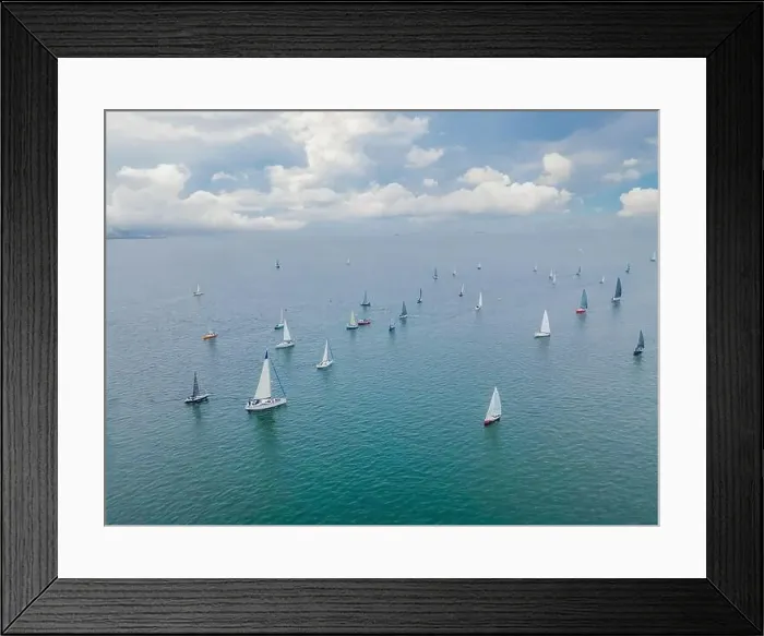 Framed Print : Aerial bird's eye view photo taken by drone of sailboat in turquoise sea water Framed Print : Aerial bird's eye view photo taken by drone of sailboat in turquoise sea water
