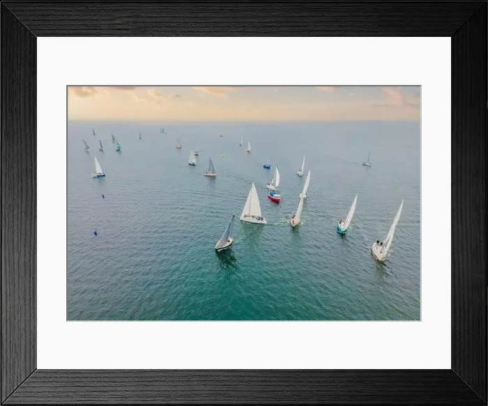 Framed Print : Aerial bird's eye view photo taken by drone of sailboat in turquoise sea water Framed Print : Aerial bird's eye view photo taken by drone of sailboat in turquoise sea water