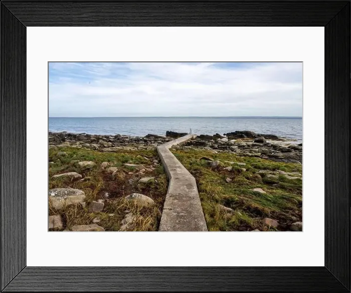 Framed Print : Rocky shoreline with a concrete jetty Framed Print : Rocky shoreline with a concrete jetty