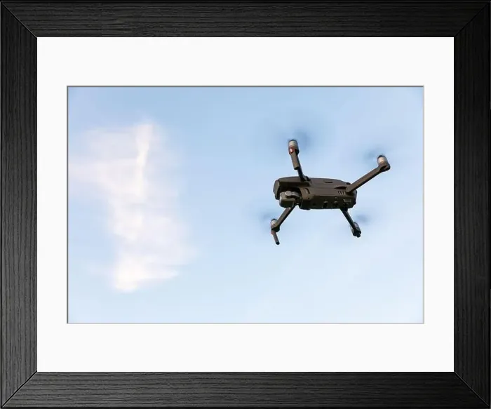 Framed Print : Drone flying over landscape. UAV drone copter flying with digital camera Framed Print : Drone flying over landscape. UAV drone copter flying with digital camera