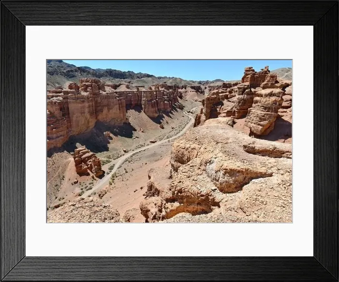 Framed Print : Canyon, panoramic sunlit view with rocks and road Framed Print : Canyon, panoramic sunlit view with rocks and road