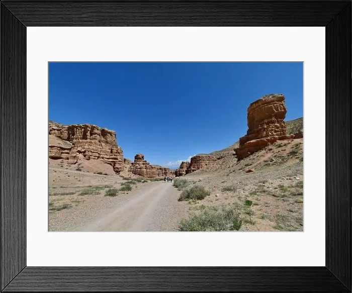Framed Print : Canyon, panoramic sunlit view with rocks and road Framed Print : Canyon, panoramic sunlit view with rocks and road