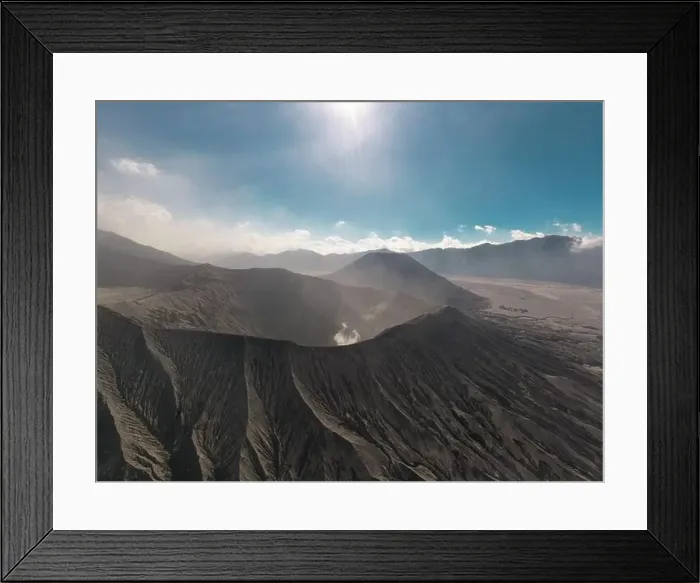 Framed Print : Cinematic shot aerial view of Mount Bromo crater edge in East Java Framed Print : Cinematic shot aerial view of Mount Bromo crater edge in East Java