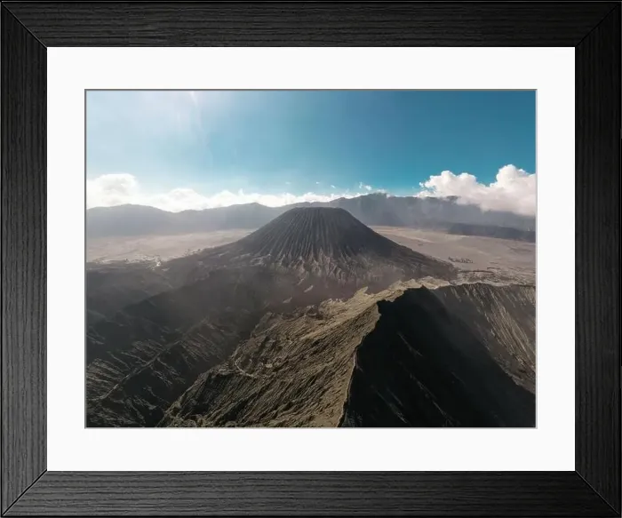 Framed Print : Cinematic shot aerial view of beautiful Mount Bromo volcano peak with desert in East Java Framed Print : Cinematic shot aerial view of beautiful Mount Bromo volcano peak with desert in East Java