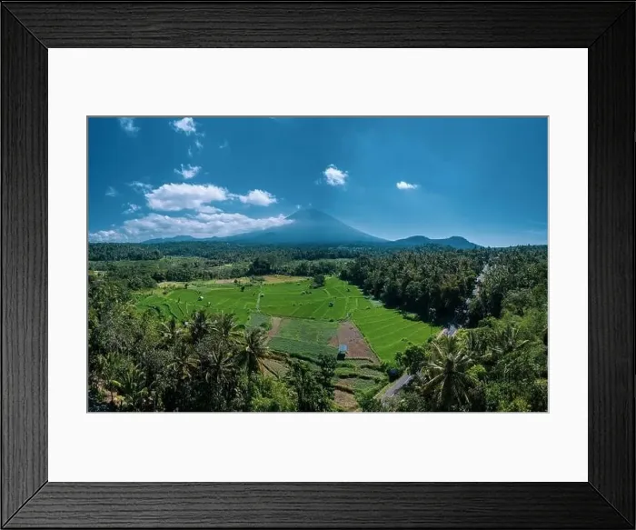 Framed Print : Aerial view of volcano and beautiful fields landscape during sunny summer day in Bali Framed Print : Aerial view of volcano and beautiful fields landscape during sunny summer day in Bali