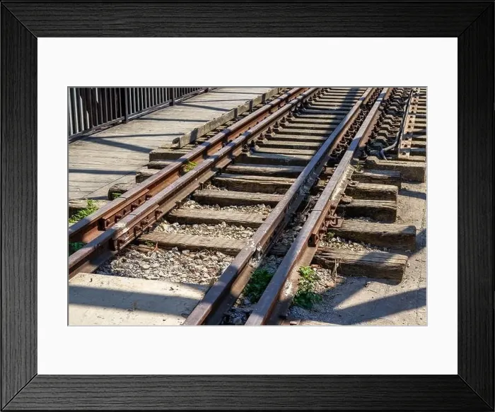 Framed Print : A railway bridge and railway tracks