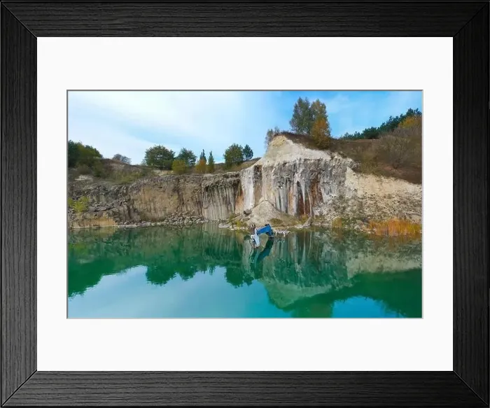 Framed Print : Flooded basalt quarry with sunken excavator.Drone view Framed Print : Flooded basalt quarry with sunken excavator.Drone view