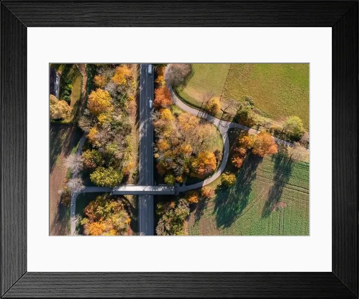 Framed Print : Top down view at a autumnal landscape with a rural street Framed Print : Top down view at a autumnal landscape with a rural street
