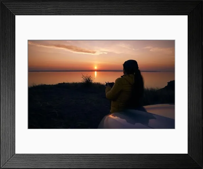Framed Print : Sunset and the figure of a woman dron remote control in to the hands. Odessa Ukraine, Belgogr Dnestrovsky estuary Framed Print : Sunset and the figure of a woman dron remote control in to the hands. Odessa Ukraine, Belgogr Dnestrovsky estuary