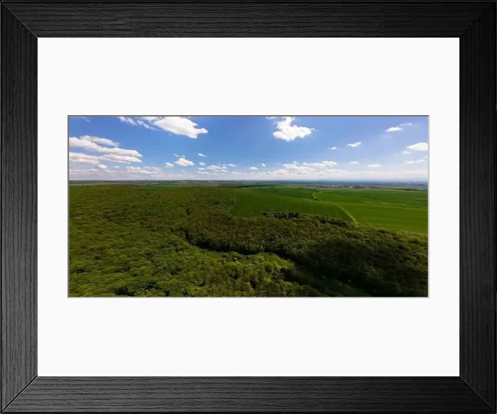 Framed Print : Aerial wide panoramic view of dark mountain hills covered with green mixed pine and lush forest in evening