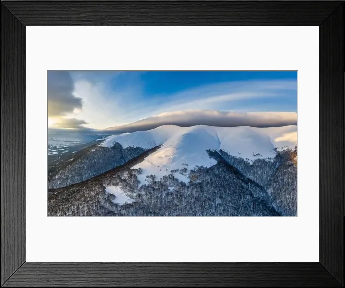 Framed Print : Aerial view of beautiful winter mountain slopes covered with snow and firs forest on a sunny cloudless day Framed Print : Aerial view of beautiful winter mountain slopes covered with snow and firs forest on a sunny cloudless day
