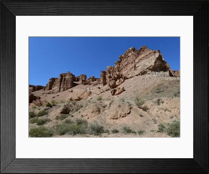 Framed Print : Canyon sunlit view with rocks and a pronounced texture of a yellowish stone Framed Print : Canyon sunlit view with rocks and a pronounced texture of a yellowish stone