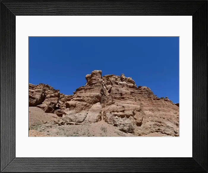 Framed Print : Canyon sunlit view with rocks and a pronounced texture of a yellowish stone Framed Print : Canyon sunlit view with rocks and a pronounced texture of a yellowish stone