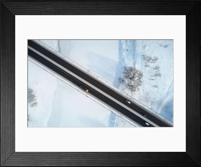 Framed Print : Travel on car in winter time theme. Bridge on winter covered snow background Framed Print : Travel on car in winter time theme. Bridge on winter covered snow background