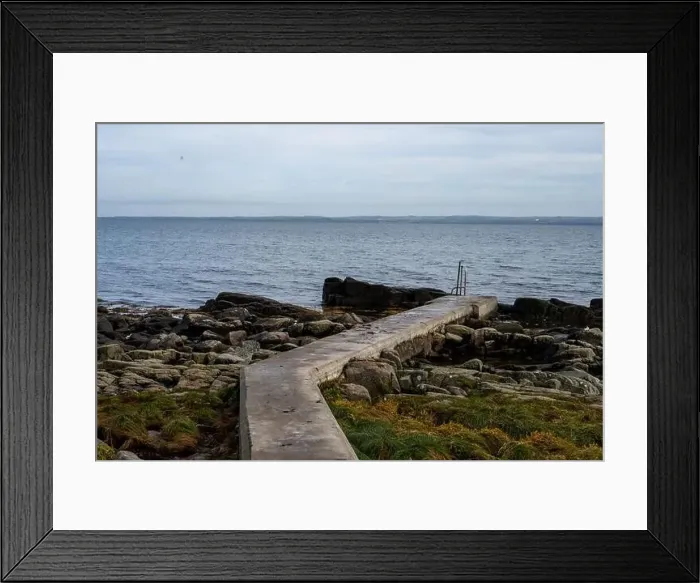 Framed Print : Rocky shoreline with a concrete jetty Framed Print : Rocky shoreline with a concrete jetty