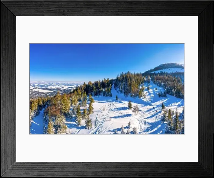 Framed Print : Magical winter panorama of beautiful snowy slopes at a ski resort in Europe on a sunny Framed Print : Magical winter panorama of beautiful snowy slopes at a ski resort in Europe on a sunny