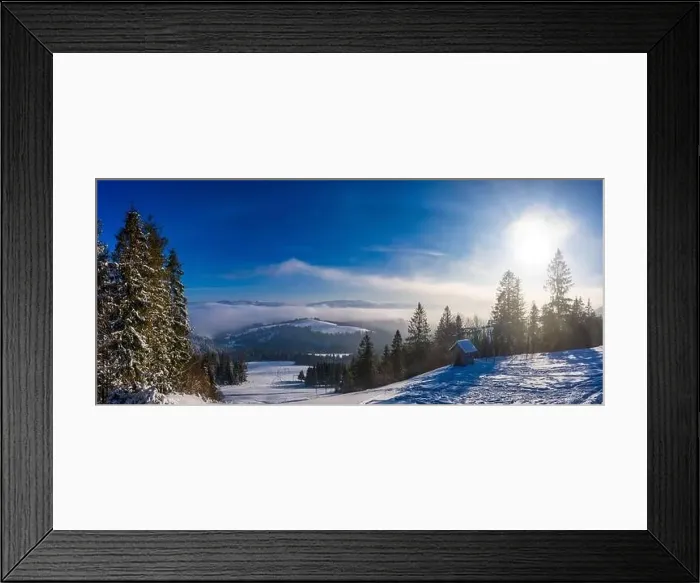 Framed Print : Magical winter panorama of beautiful snowy slopes at a ski resort in Europe on a sunny Framed Print : Magical winter panorama of beautiful snowy slopes at a ski resort in Europe on a sunny