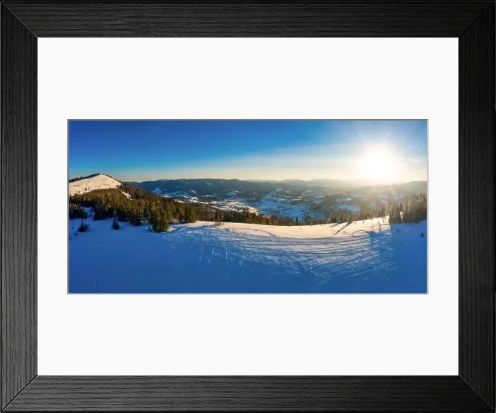 Framed Print : Aerial view of beautiful winter mountain slopes covered with snow and firs forest on a sunny cloudless day Framed Print : Aerial view of beautiful winter mountain slopes covered with snow and firs forest on a sunny cloudless day