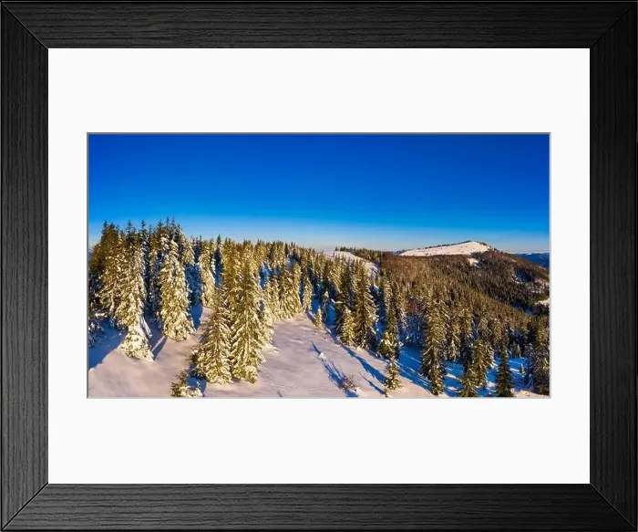 Framed Print : Magical winter panorama of beautiful snowy slopes at a ski resort in Europe on a sunny Framed Print : Magical winter panorama of beautiful snowy slopes at a ski resort in Europe on a sunny