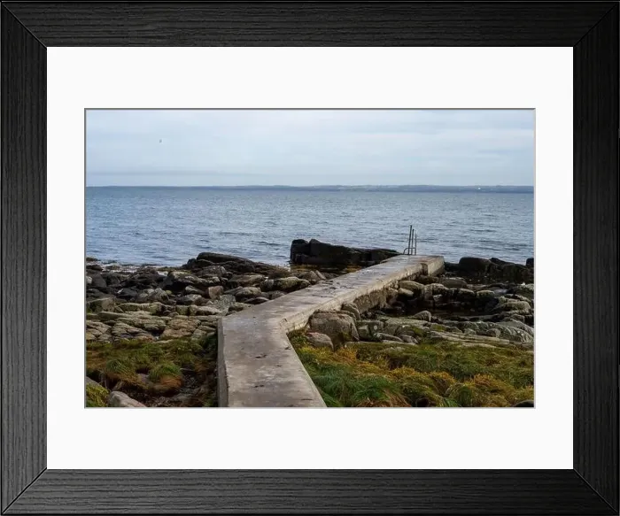 Framed Print : Rocky shoreline with a concrete jetty Framed Print : Rocky shoreline with a concrete jetty