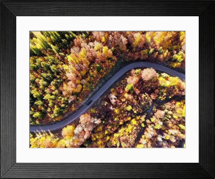 Framed Print : Car driving on a mountain road somewhere in French Alps Framed Print : Car driving on a mountain road somewhere in French Alps