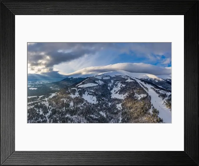 Framed Print : Aerial view of beautiful winter mountain slopes covered with snow and firs forest on a sunny cloudless day Framed Print : Aerial view of beautiful winter mountain slopes covered with snow and firs forest on a sunny cloudless day