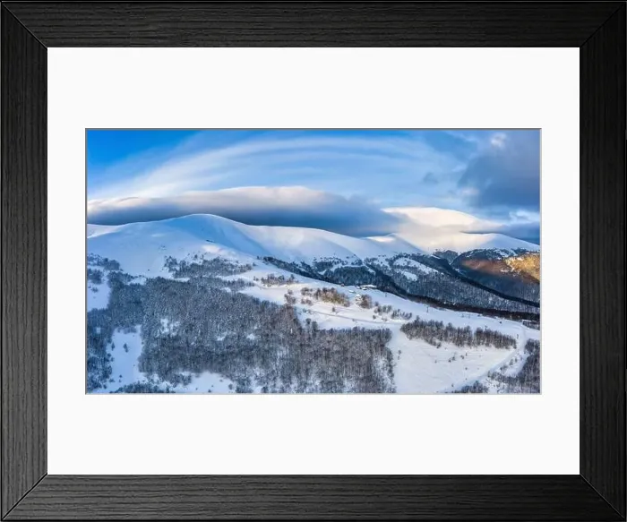 Framed Print : Aerial view of beautiful winter mountain slopes covered with snow and firs forest on a sunny cloudless day Framed Print : Aerial view of beautiful winter mountain slopes covered with snow and firs forest on a sunny cloudless day