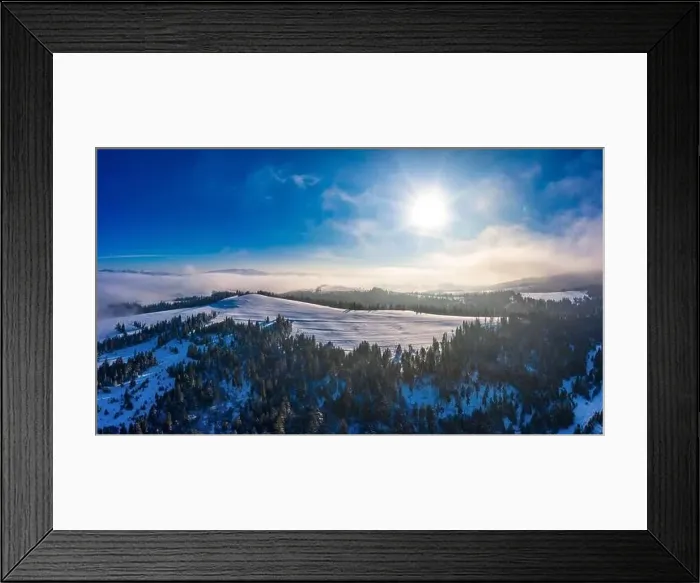 Framed Print : Picturesque winter panorama of mountain hills covered with snow and fir trees on a sunny clear day with the sun Framed Print : Picturesque winter panorama of mountain hills covered with snow and fir trees on a sunny clear day with the sun